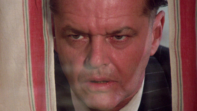 Jack Nicholson as Francis Phelan stares through a window in Ironweed