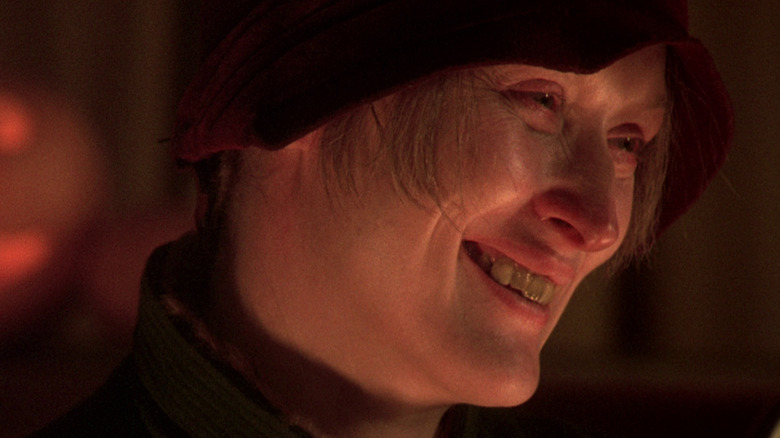 Meryl Streep grins in a red cap as Helen Archer in Ironweed