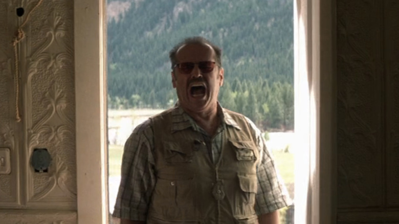 Jack Nicholson's Jerry Black stands in a doorway screaming in The Pledge