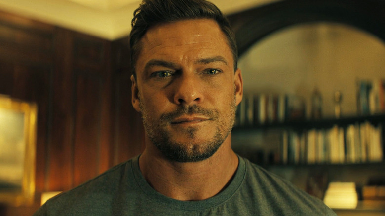 Alan Ritchson's Jack Reacher is seen in closeup in Reacher