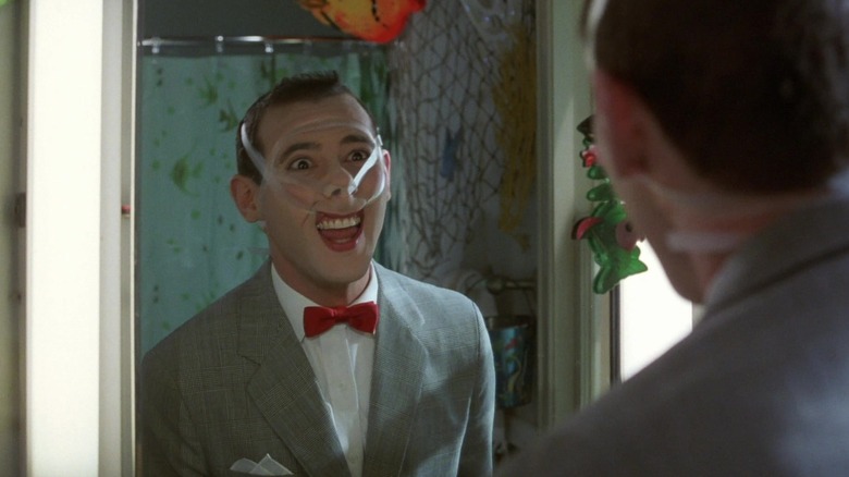 Pee Wee with tape all over his face in Pee Wee's Big Adventure