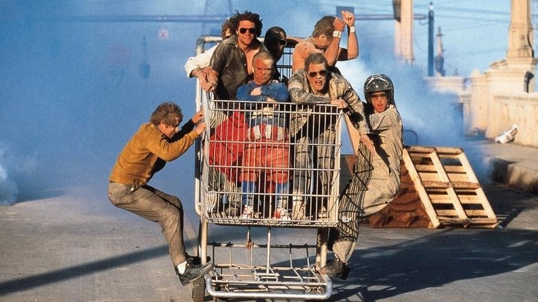 The Jackass cast in the shopping coart covered in dust in the opening of Jackass: The Movie