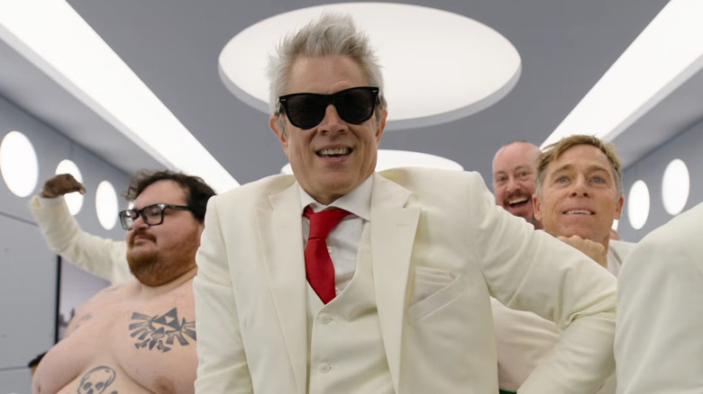 Jonny Knoxville in his white suit with Zach Holmes, Danger Ehren, and Dave England behind him in Jackass: Best and Last