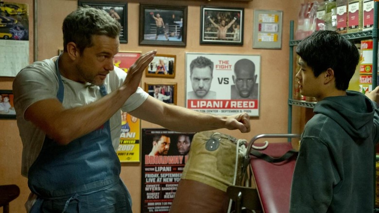 Victor pretending to spar with Li who has his arms by his sides in Karate Kid: Legends