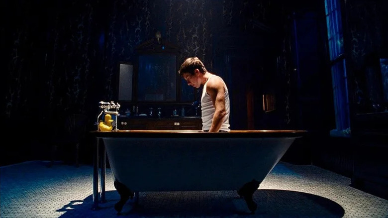 Barry Keoghan's Oliver Quick kneels in a bathtub in Saltburn.webp