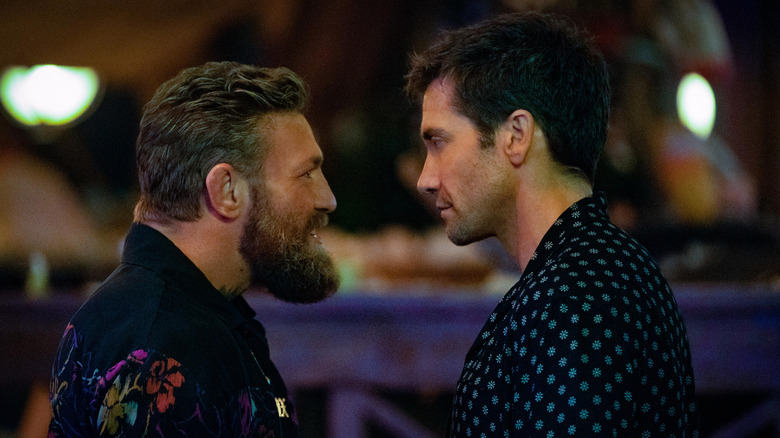 Conor McGregor as Knox stands face to face with Jake Gyllenhaal as Dalton in Road House (2024)