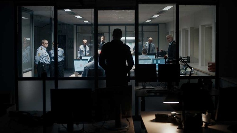 The Guilty (2018) is shaded from Astger Holm while other police officers are seen