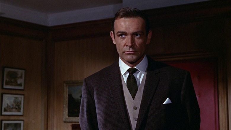 Sean Connery's James Bond standing in M's office in Goldfinger