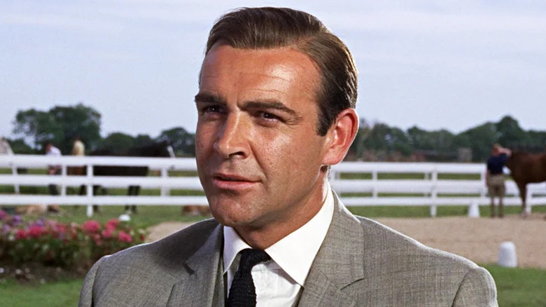 Sean Connery's James Bond wearing a grey suit in Goldfinger