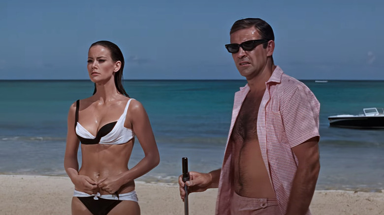 Sean Connery as James Bond and Claudine Auger as Domino hit the beach in Thunderball