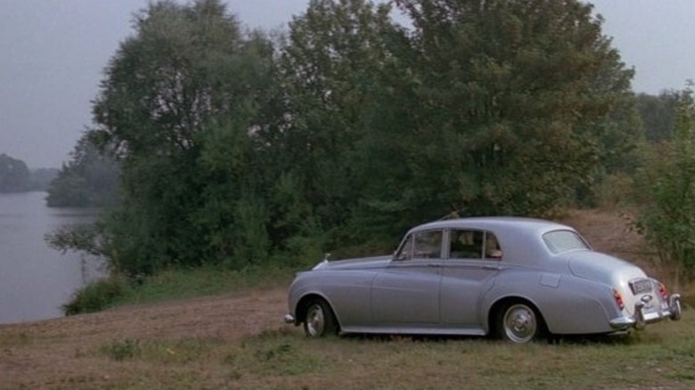 The 1962 Rolls-Royce Silver Cloud II parked in front of a pond in A View to a Kill
