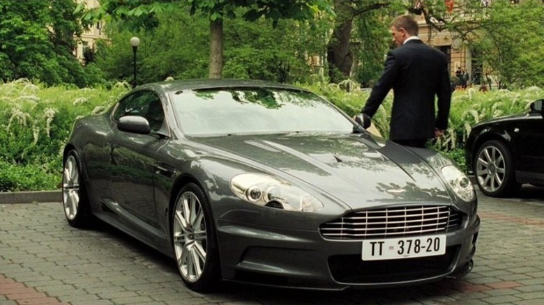 Daniel Craig as James Bond opening the door of the 2007 Aston Martin DBS V12 in Casino Royale