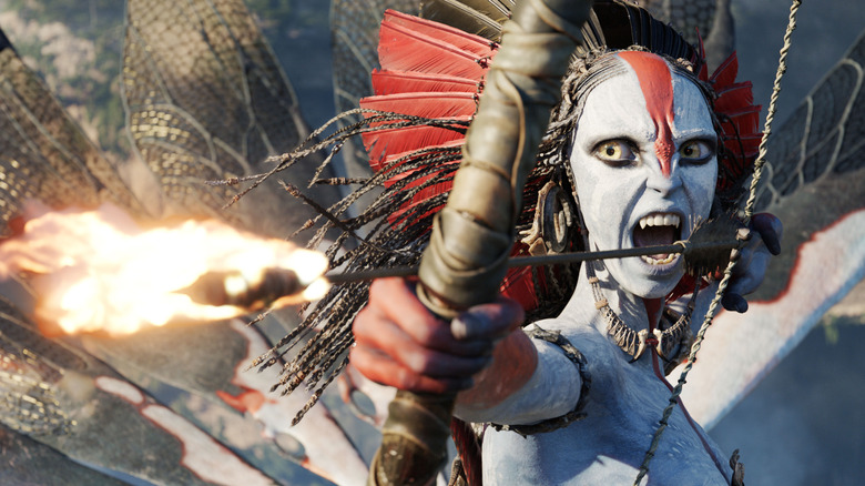 Oona Chaplin as Varang with a flaming arrow in her bow in Avatar: Fire and Ash