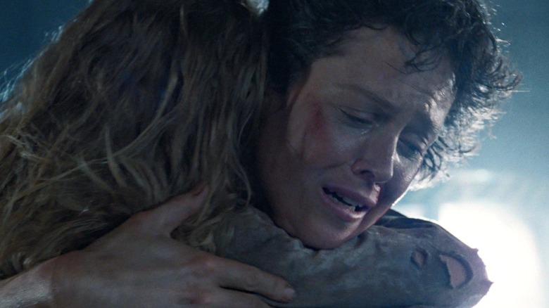 Sigourney Weaver's Ellen Ripley hugs Carrie Henn's Newt in Aliens