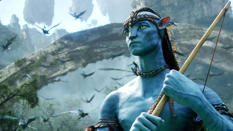 Sam Worthington's Jake Sully holding a bow in Avatar