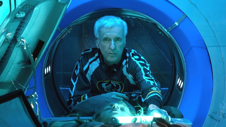 James Cameron looking through a pod on the set of Avatar: The Way of Water