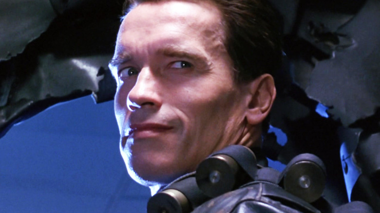 Arnold Schwarzenegger's Terminator turns and smiles in closeup in Terminator 2 Judgment Day