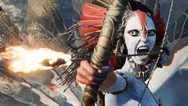 Oona Chaplin as Varang with a flaming arrow in her bow in Avatar: Fire and Ash