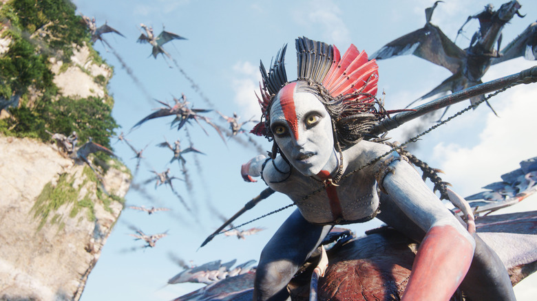 Oona Chaplin as Varang soaring through the air on a winged creature in Avatar: Fire and Ash