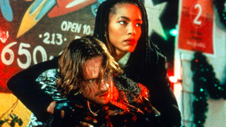 Ralph Fiennes as Lenny and Angela Bassett as Mace in Strange Days