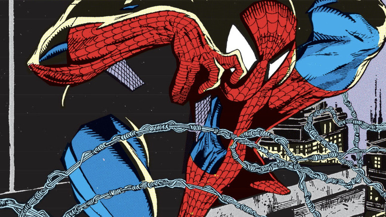 Spider-Man crouches on a ledge surrounding by lines of webbing in Spider-Man #2