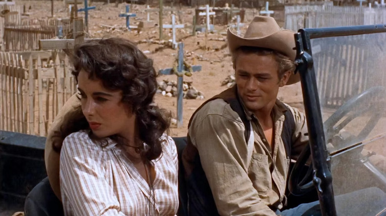 Leslie Benedict and Jett Rink in a car next to a cemetary in Giant
