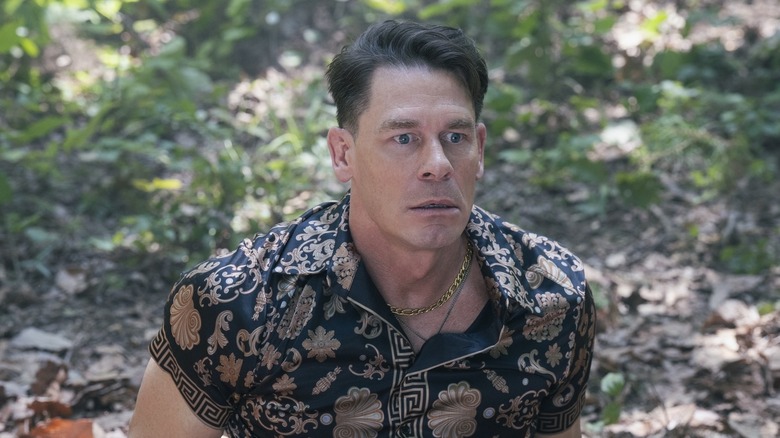 John Cena as Christopher Smith wearing a very loud silk shirt on Peacemaker