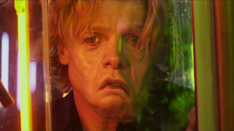 Tom Rhys Harries as Matt Hagan with his face melting in Clayface