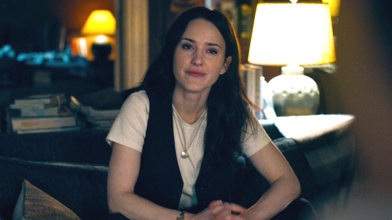 Rachel Brosnahan as Lois Lane interviewing Superman on the couch in Superman