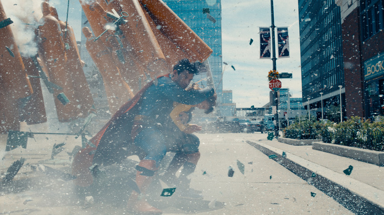 Superman protecting a child in James Gunn's Superman