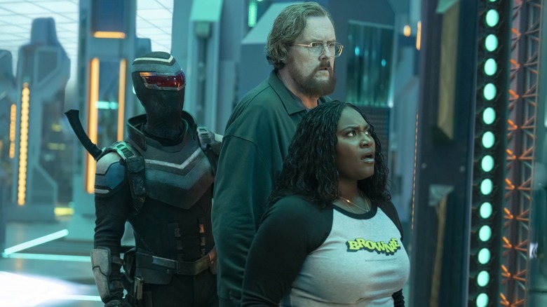 Vigilante, Adebayo, and Economos look shocked and apalled inside Peacemaker's pocket dimension in Peacemaker
