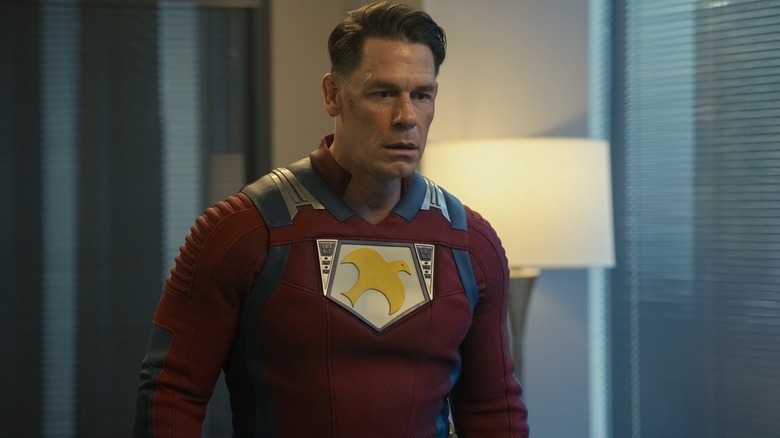 Chris has a look of shock in his face as if he's just now realized he's in a Nazi dimension in Peacemaker