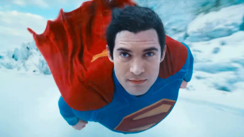 Superman flies through the frozen Arctic area directly into the camera 