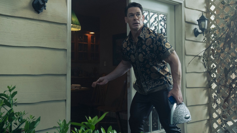Peacemaker trying to get Eagly to follow him with a piece of meat in Peacemaker season 2