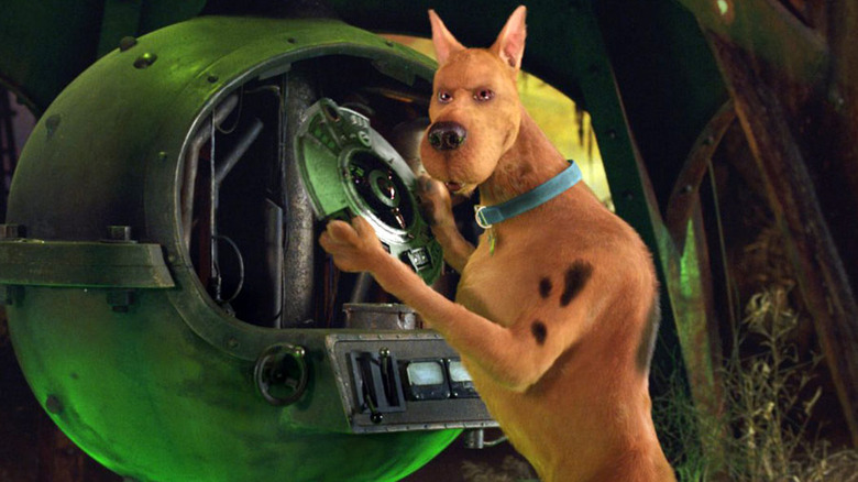 Neil Faning in the role of Scooby-Doo holding the switch in 