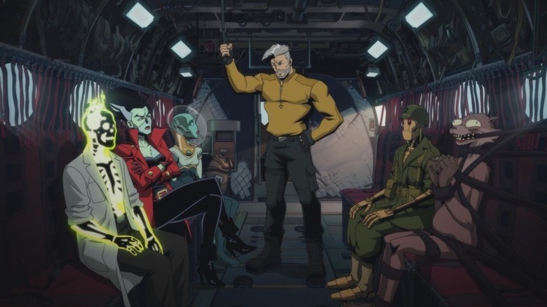 Doctor Phosphorus, the Bride, Nina Mazursky, Rick Flag Sr., GI Robot, and Weasel sitting on a plane in Creature Commandos