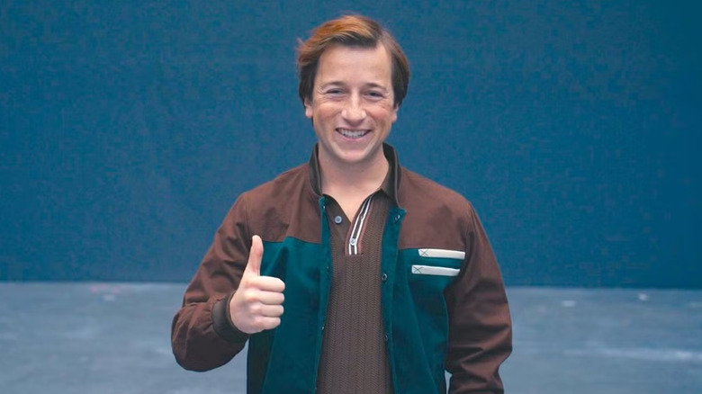 Skyler Gisondo in character as Jimmy Olsen giving a thumbs up in Superman