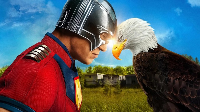 Peacemaker season 2 poster -- John Cena as Peacemaker sharing headbutt with Eagly