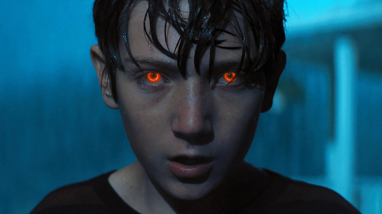 Brandon Breyer with glowing red eyes in the movie Brightburn