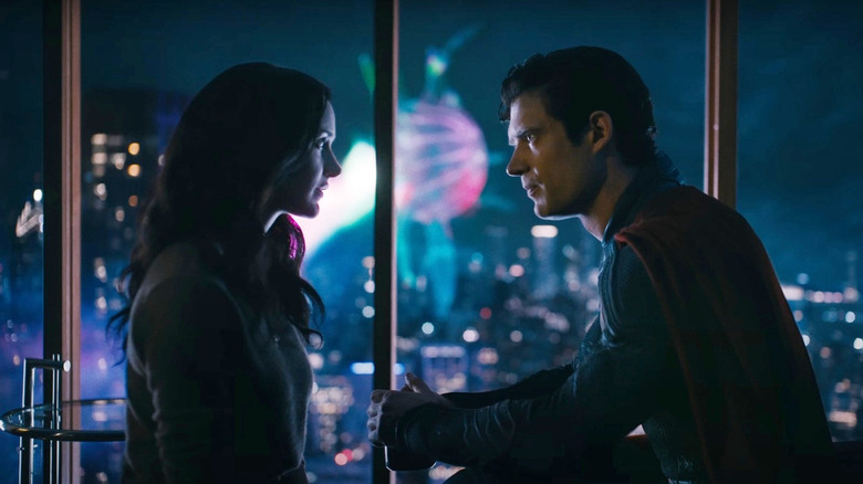 David Carensuet as Superman and Rachel Brosnahan as Lois Lane stare intently at each other in 