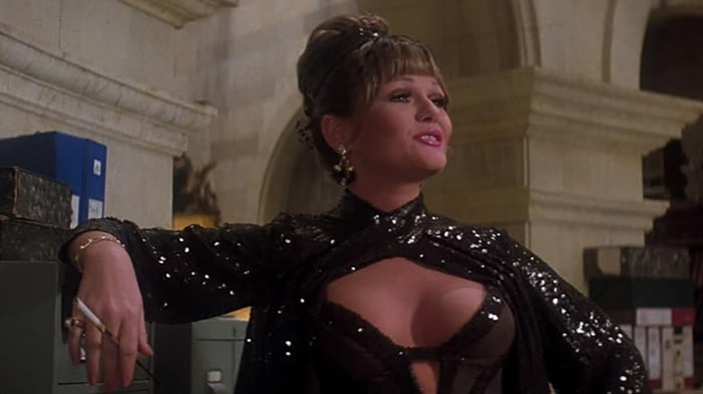 Eve Teschmacher looks glamorous, smoking a cigarette in Superman: Film