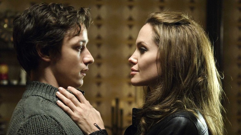 James McAvoy as Wesley looking at Angelina Jolie as Fox as she reaches for his neck in Wanted