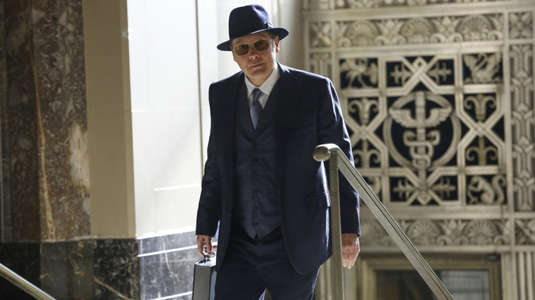 James Spader wearing sunglasses inside