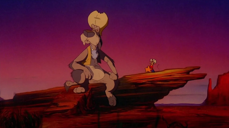 Wylie Burp and Fievel sitting on a rock at sunset in An American Tail: Fievel Goes West