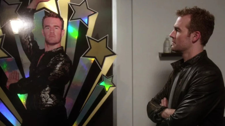 James Van Der Beek as James looking at a holographic standee of himself on Don't Trust the B---- in Apartment 23