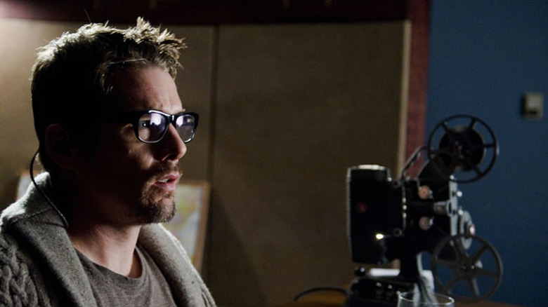Ethan Hawke gets spooked by home movies in Sinister (2012)