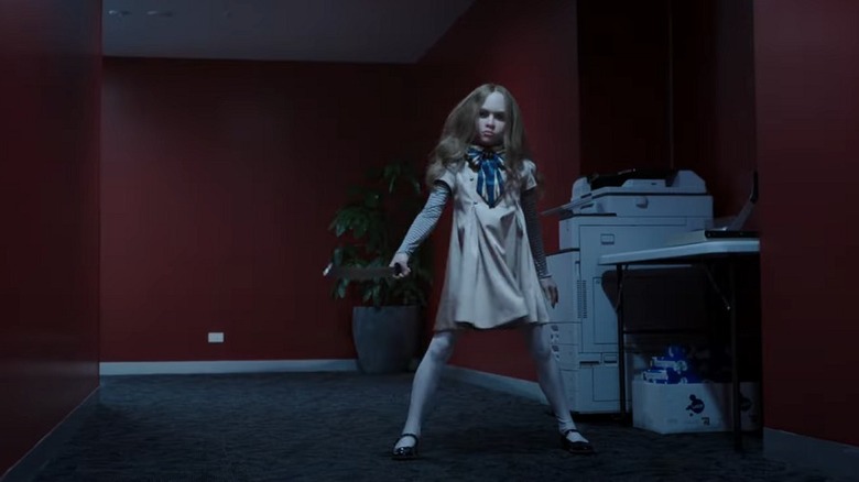 M3GAN doll with a knife in M3GAN