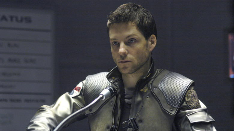 Lee Adama at podium in pilot gear