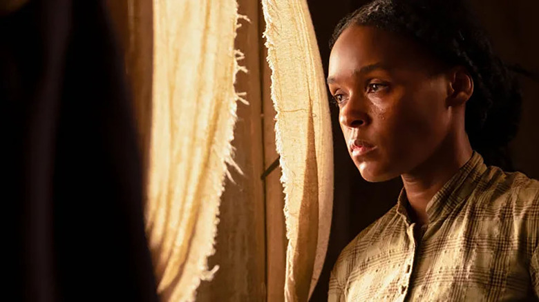 janelle monae looking out a window in the movie antebellum