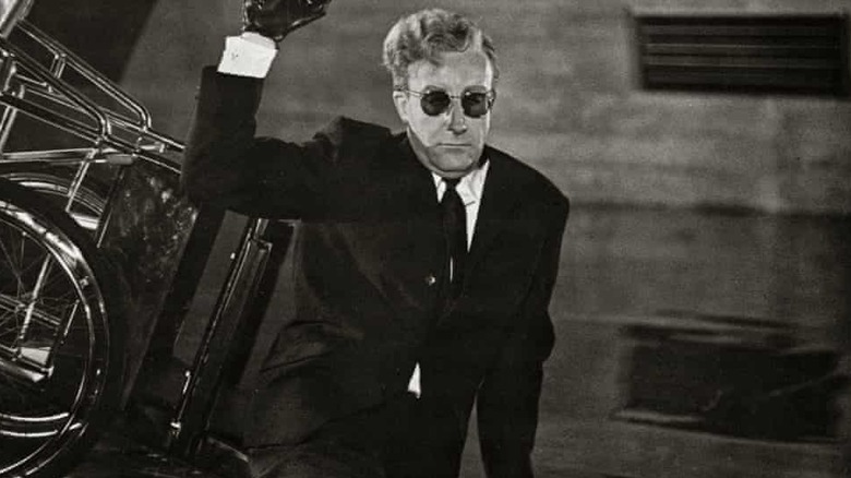 Dr Strangelove holds pistol